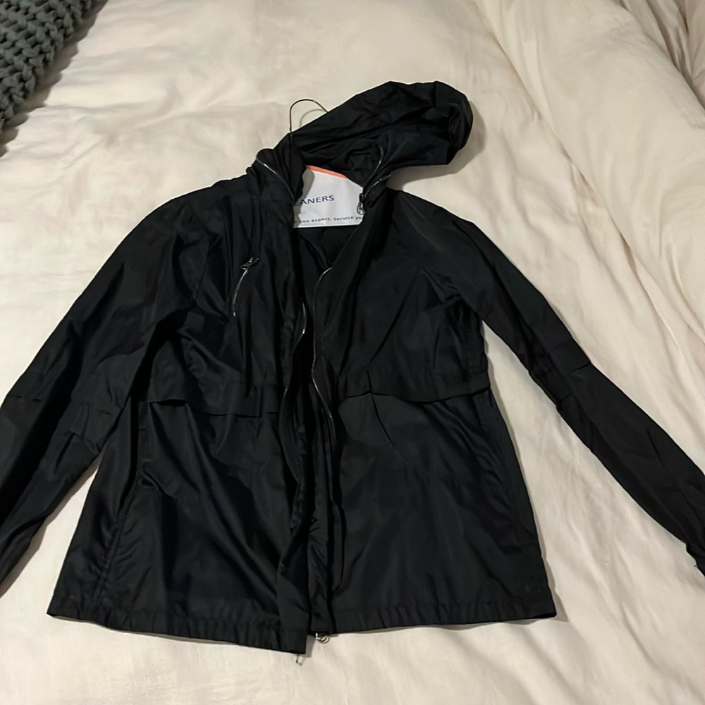 Black hooded rain jacket